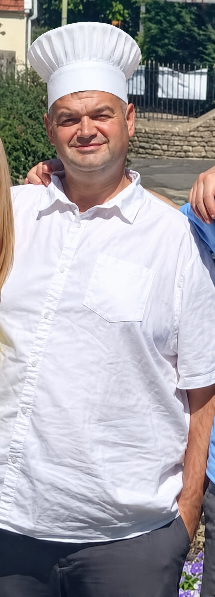 Pip Elsworth wearing a chef hat and white shirt